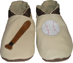 All Tan leather crib shoe with baseball bat and baseball. 