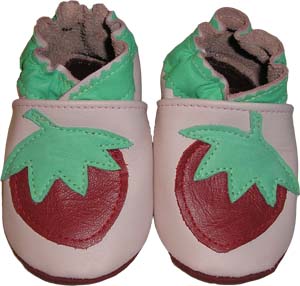 These lovely pink shoes are flourished with a red, ripe strawberry for your little sweethearts.