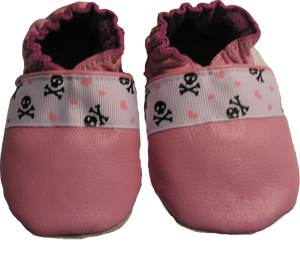 Pink shoe embellished with skull, crossbones and hearts trim